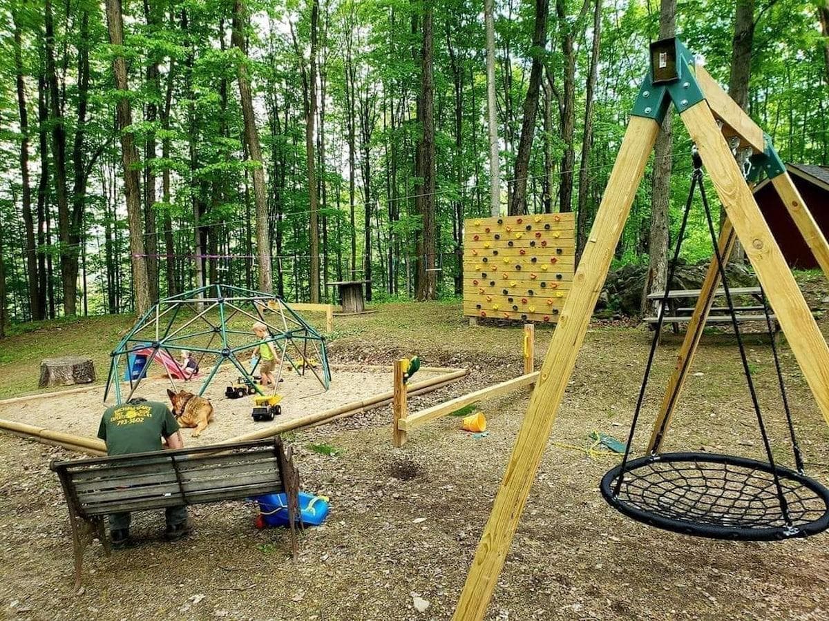 Playground within sight of cabin and camper spots.